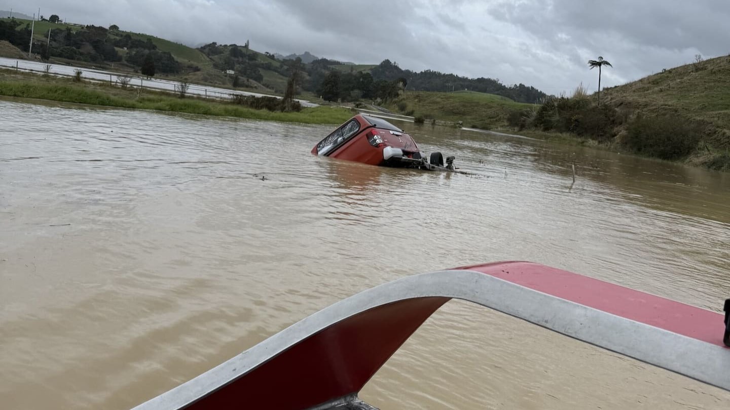 Mark Looney's truck and trailer got caught in the flood waters as he was trying to get his jetboat to a scene to help with another rescue.