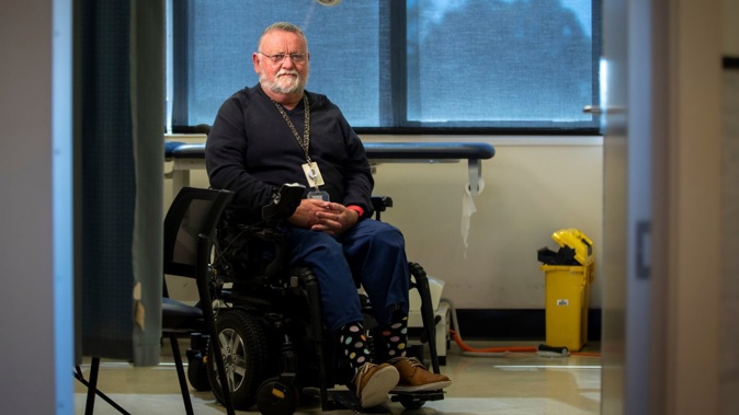 Dr Cary Mellow had both legs amputated below the knee in separate operations. It has only been a minor setback for his work, he says. Photograph / Michael Craig