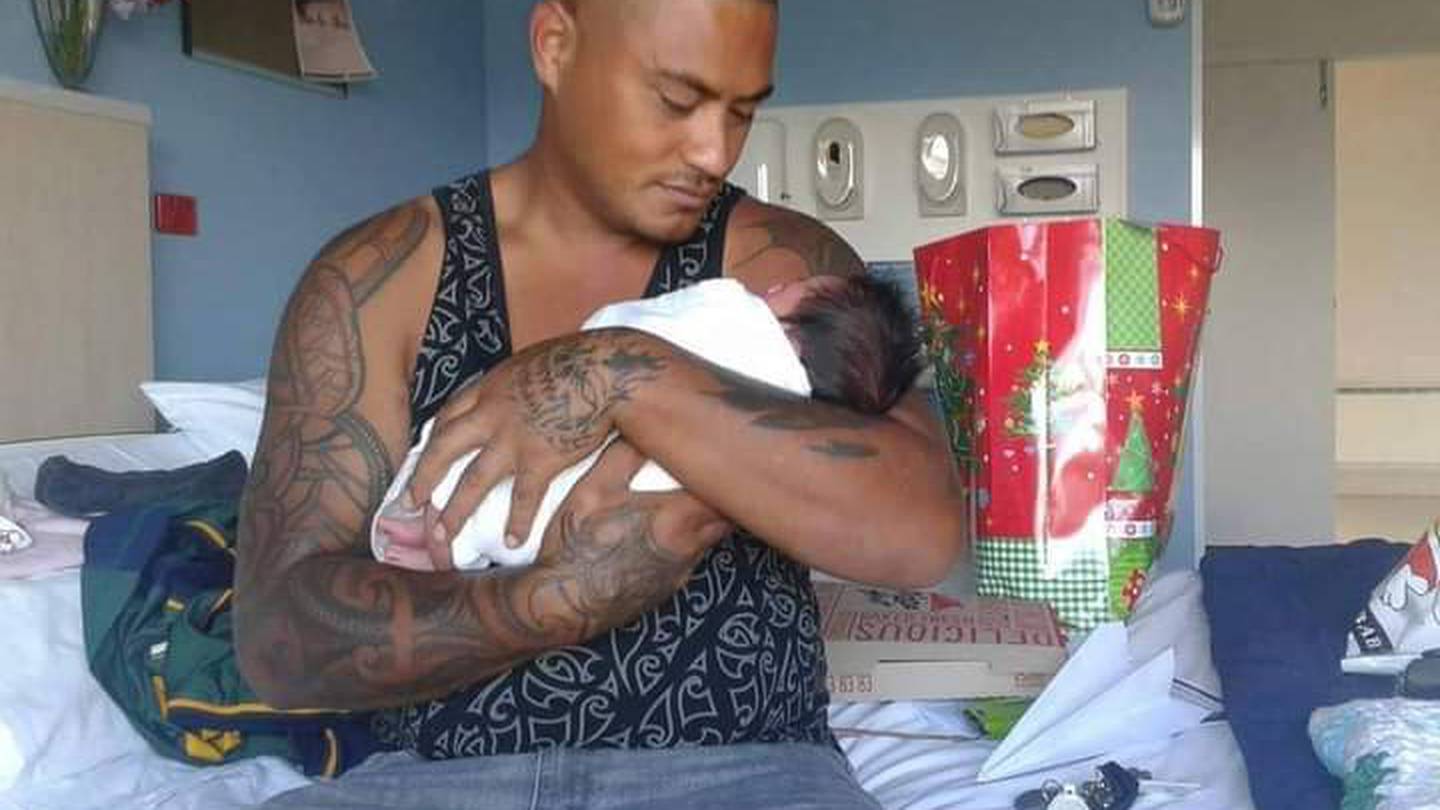 Vaughan Te Moananui holding his first grandchild, who he got to spend five months with before being shot by police. Photo / Supplied