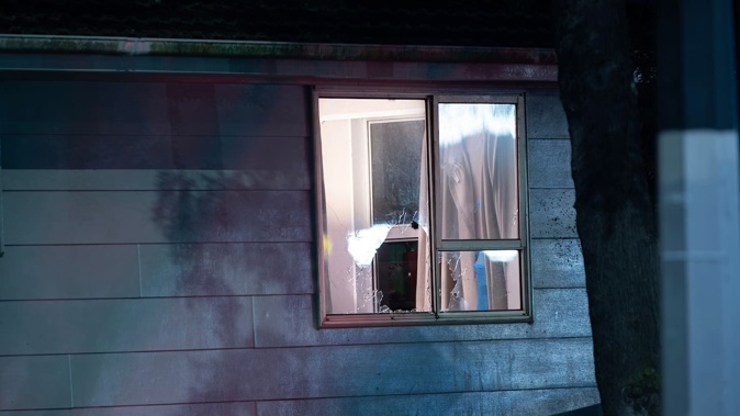 A smashed window following a drive-by shooting on Roscommon Rd in Weymouth overnight. Photo / Hayden Woodward