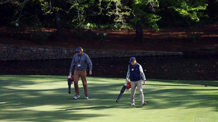 Grounds crew workers blow debris off the 11th green that the wind has blown off the trees during the second round of the 2024 Masters Tournament. Photo / Getty