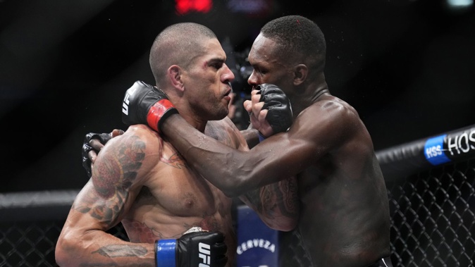 Alex Pereira beat Israel Adesanya via fifth round TKO to claim the UFC middleweight belt. Photo / Getty