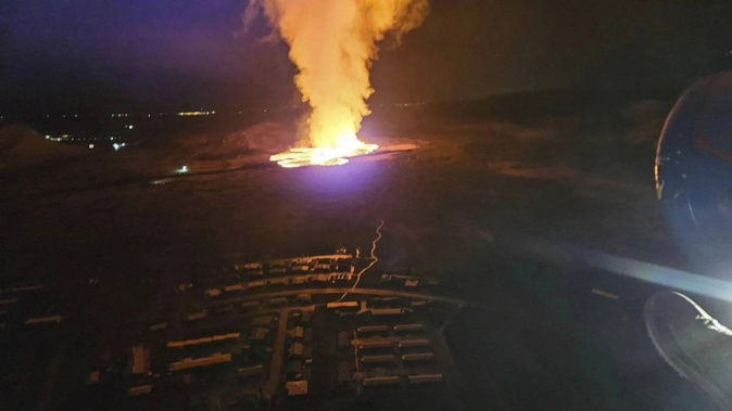 A volcano has erupted near Grindavík in southwestern Iceland, sending molten rock spewing toward the settlement. Photo / Icelandic Civil Protection via AP