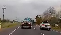 Moment of madness - overtaking car slams into turning milk tanker