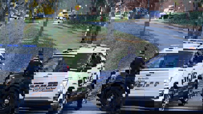 Charlottesville police secure the crime scene of an overnight shooting at the University of Virginia. Photo / AP