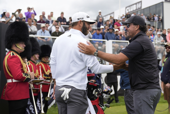 Dustin Johnson of the United States, left, and Phil Mickelson of the United States greet each other on the first tee during the first round of the inaugural LIV Golf Invitational at the Centurion Club in St. Albans, England. Photo / AP