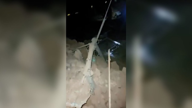 This still from a video released Saturday, July 8, 2023, by the paramilitary group Rapid Support Forces (RSF) shows the aftermath of an airstrike in the city of Omdurman. Rapid Support Forces
