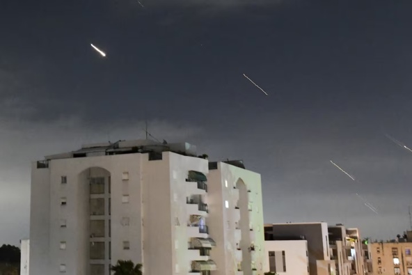 Israeli Iron Dome air defence system launches to intercept missiles fired from Iran, in central Israel. Photo / AP