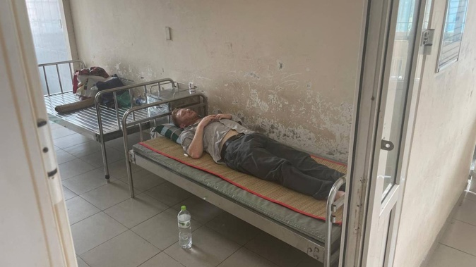 Ballad Woodley-Hanan on his bed in the Vietnamese hospital. (Photo / Dempsey Woodley)
