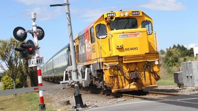 A Wairarapa passenger train crosses Ngaumutawa Rd in Masterton on its way to Wellington.