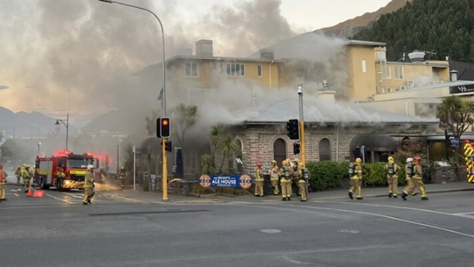 Firefighters attend the blaze at Speight's Ale House, Queenstown. Photo / James Allan