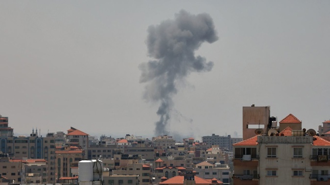 Smoke billows following renewed Israeli military strikes launched into Gaza on May 10, 2023. Mahmud Hams/AFP/Getty Images