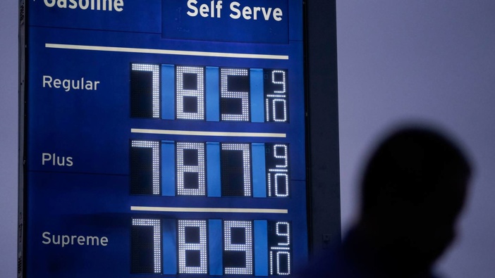 High gas prices are shown as a pedestrian waits to cross the street in Los Angeles. Photo / Jae C. Hong, AP