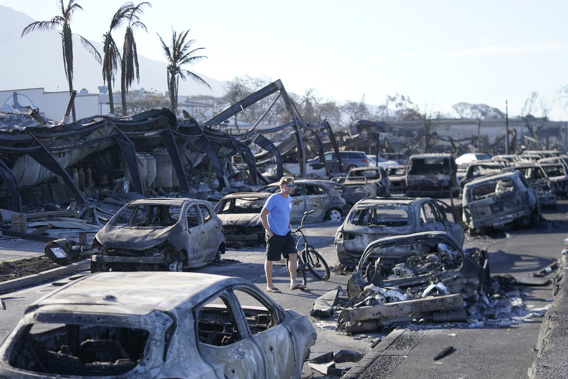 A man walks through wildfire wreckage Friday, Aug. 11, 2023, in Lahaina, Hawaii. Photo / AP