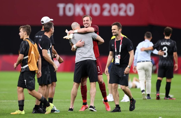 Oly Whites coach Danny Hay celebrated with goalkeeper Michael Woud, who had a bounce-back game. (Photo / Getty)