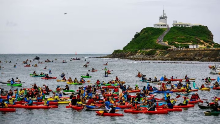 People take to the water as they gather in protest for climate action at Horseshoe Beach on November 25 last year in Newcastle, Australia. Now another protest supporting a smiliar cause has been held and more than 150 people arrested. Photo / Roni Bintang, Getty Images