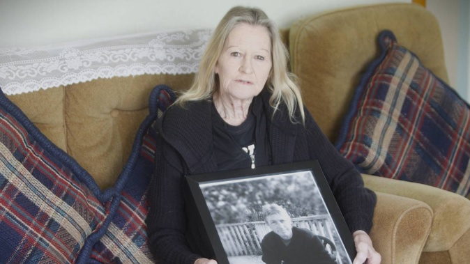 Glen Collins' mother Karilyn holds a photo of him in her Porirua lounge. Photo / Hazel Osborne