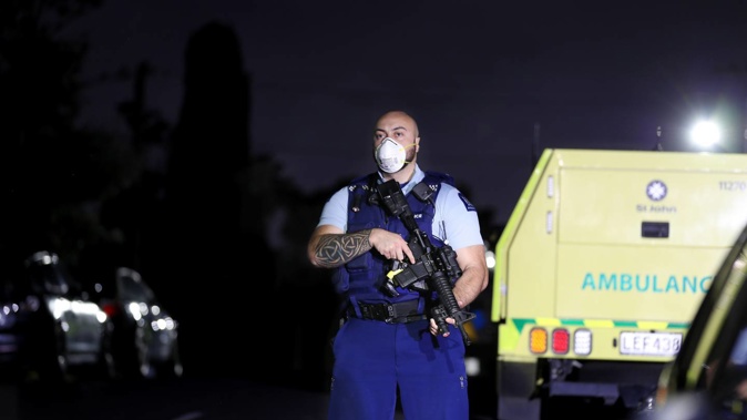 Armed police at the scene in Mt Roskill last night. (Photo / Hayden Woodward)