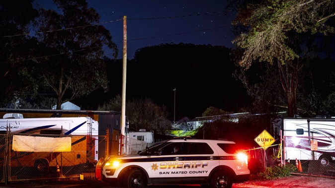 Police tape from the San Mateo Country Sheriffs office marks the perimeter of the scene of a shooting, after a gunman killed several people at two agricultural businesses in California. Photo / AP