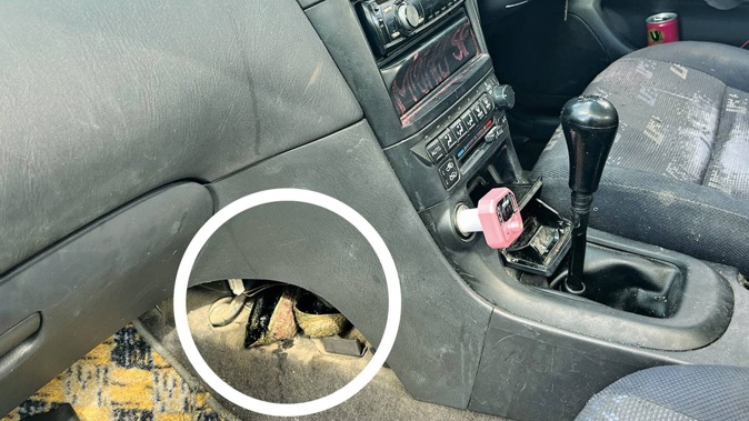 Paua hidden underneath the transmission of a car stopped by police near Mahia. Photo / NZ Police