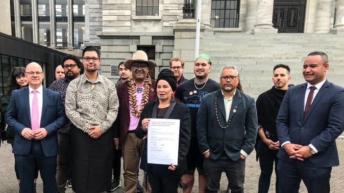 Debbie Ngarewa-Packer, co-leader of Te Pāti Maori accepting petition from Benji Timu and Josiah Tualamali'i.