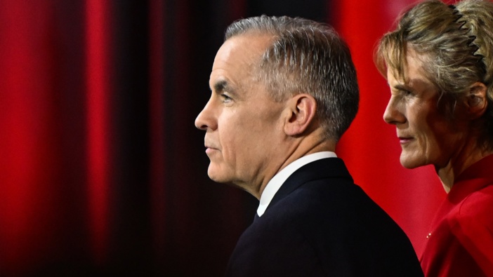 Mark Carney and his wife, Diana Carney, listen as Prime Minister Justin Trudeau delivers a speech at the 2025 Liberal Leadership results announcement event at Rogers Centre in Ottawa, Ontario, Canada, on March 9, 2025. (Photo by Artur Widak/NurPhoto via Getty Images)