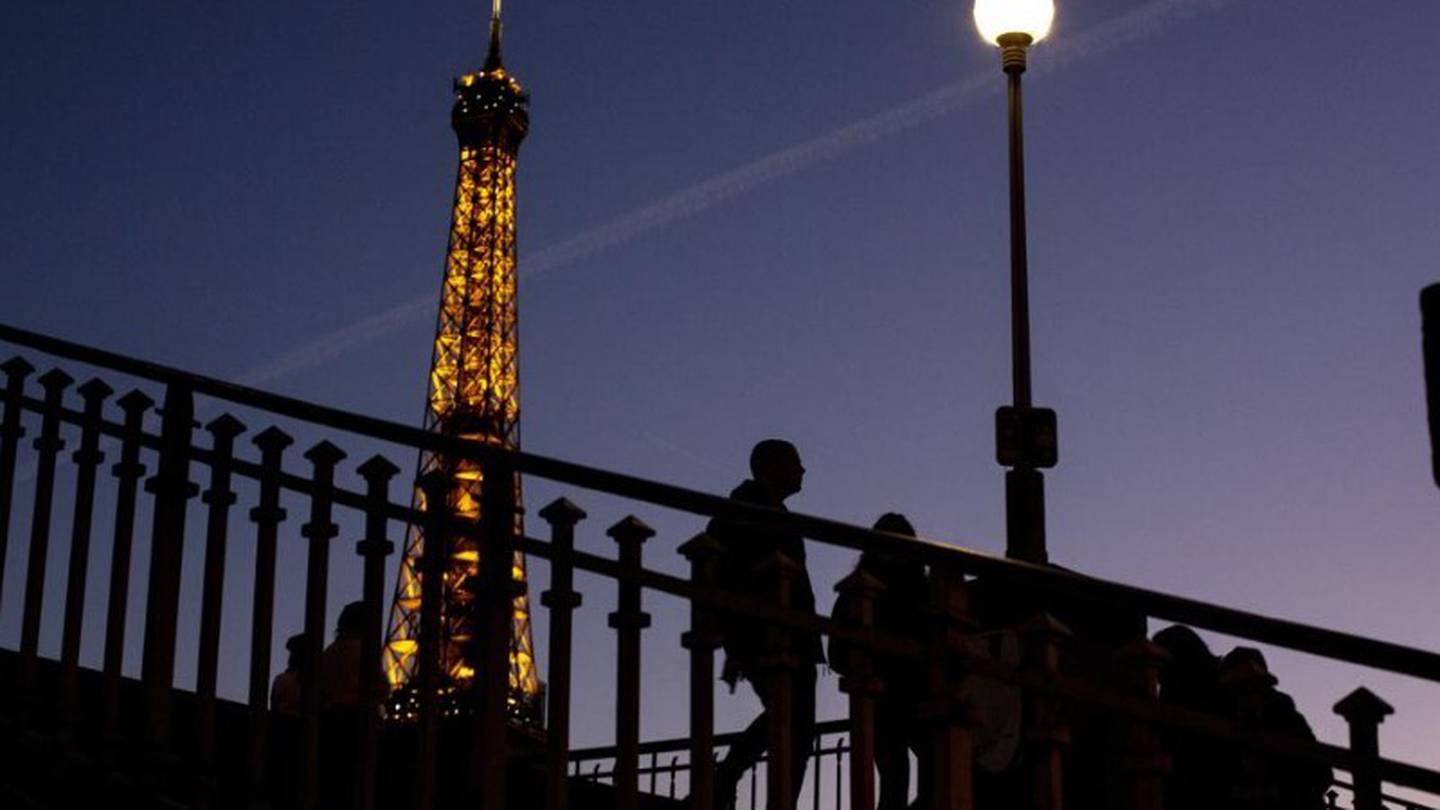 Lights on the Eiffel Tower will soon be turned off an hour earlier at night as part of an energy savings plan. Photo / AP