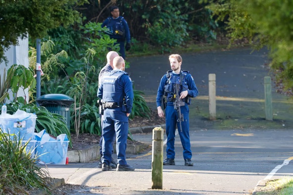 Police guard the scene of a homicide in Auckland's Blockhouse Bay. Photo / Michael Craig