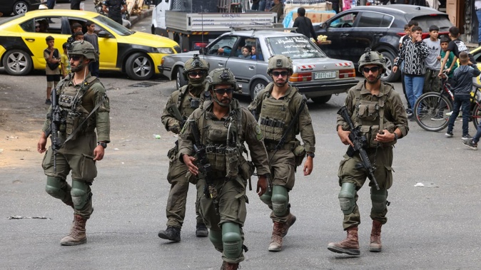 Israeli security forces in the occupied West Bank city of Hebron. A United States military team will oversee the Gaza ceasefire between Israel and Hamas. 'And the Israelis will obviously be in constant touch with them,' a US official said. Photo / Hazem Bader, AFP