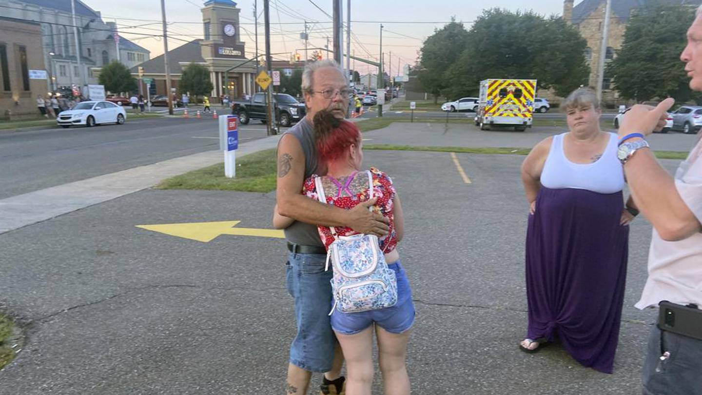 Nescopeck Volunteer Fire Company firefighter Harold Baker is comforted at the scene in Berwick. Photo / AP