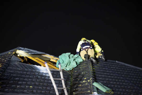 Multiple firefighters attended a home on Ballybay Road, East Tamaki, after a tornado caused roof tiles to lift, leaving a hole in the occupant's roof. Photo / Hayden Woodward