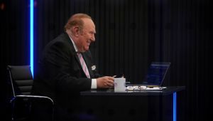 Presenter Andrew Neil prepares to broadcast from a studio during the launch event for new TV channel GB News in London. (Photo / AP)
