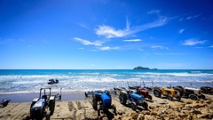 Using tractors to launch boats is a part of summer at Waimarama Beach.
