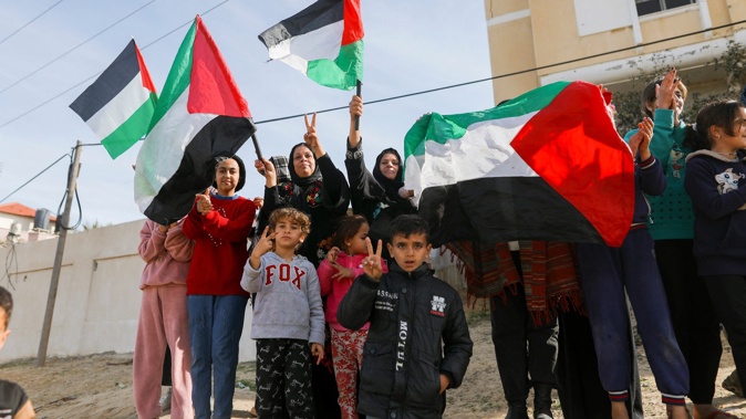 Palestinians gather to celebrate in the streets of Rafah, Gaza Strip. Photo / AFP