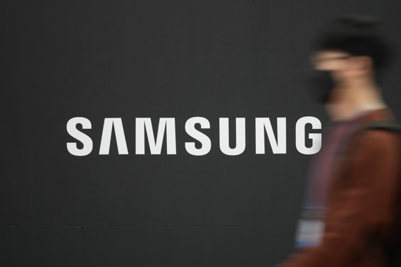 A visitor walks near the logo of Samsung Electronics in Seoul, South Korea. Photo / AP