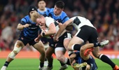 Blair Murray of Wales receives support from team-mate Max Llewellyn as he is held by Charlie Lawrence and Naoto Saito of Japan during the Quilter Nations Series 2025 rugby international match between Wales and Japan at Principality Stadium on November 15, 2025 in Cardiff, Wales. (Photo by Dan Istitene/Getty Images)