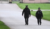 Police Officers patrol near the gates of the Royal Lodge, Andrew Mountbatten-Windsor's former residence in Windsor Great Park, February 19, 2026 in Windsor, England. (Photo by Leon Neal/Getty Images)
