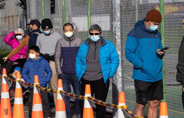 People waiting in line to be tested for Covid-19 at Haitaitai Park in Wellington. Photo / Mark Mitchell