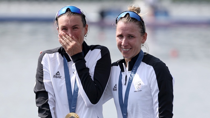 Gold medalists Brooke Francis and Lucy Spoors of Team New Zealand celebrate on the podium at the Rowing Women's Double Sculls medal ceremony on day six of the Olympic Games Paris 2024 at Vaires-Sur-Marne Nautical Stadium on August 01, 2024 in Paris, France. (Photo by Alex Davidson/Getty Images)