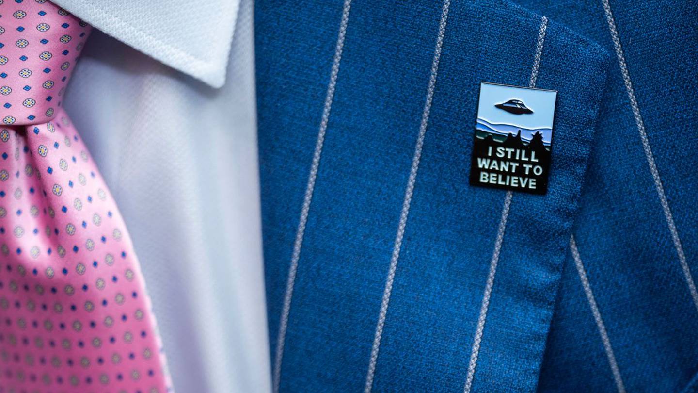 An audience member wears a UFO pin during a House Oversight and Accountability subcommittee hearing on UFOs. Photo / AP