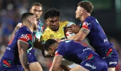 Sialetili Faeamani of the Titans is tackled during the round seven NRL match between New Zealand Warriors and Gold Coast Titans at Go Media Stadium, on April 18, 2026, in Auckland, New Zealand. (Photo by Phil Walter/Getty Images)