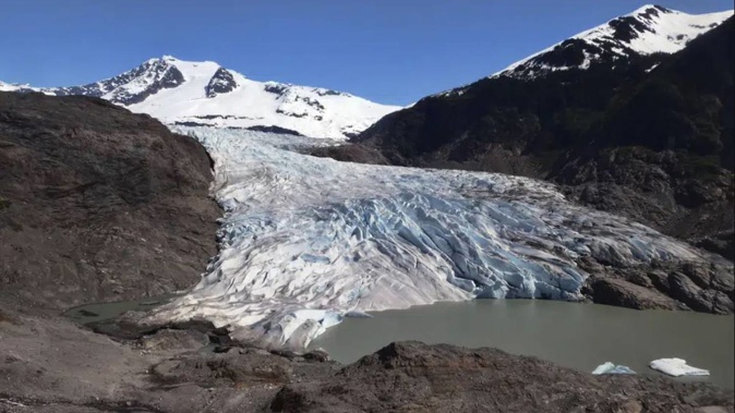 Chunks of ice float on Mendenhall Lake in front of the Mendenhall Glacier. Photo AP