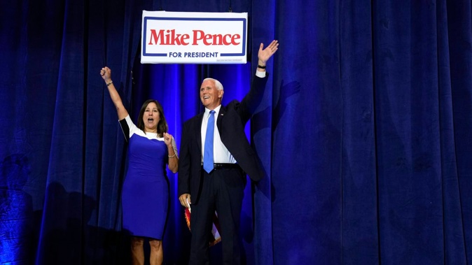 Republican presidential candidate former Vice President Mike Pence and his wife Karen arrives to speak at a campaign event. Photo / AP