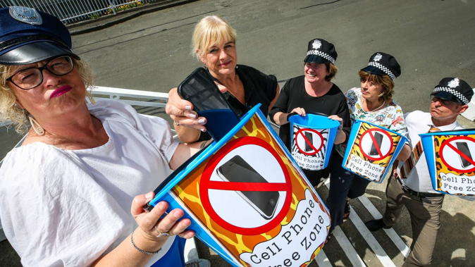 Senior Napier Girls' High School staff members Mandy Johnson, left, Dawn Ackroyd (principal), Rachel Roberts, Megan Mannering, and Philipp Otto are now the cellphone police. Photo / Paul Taylor