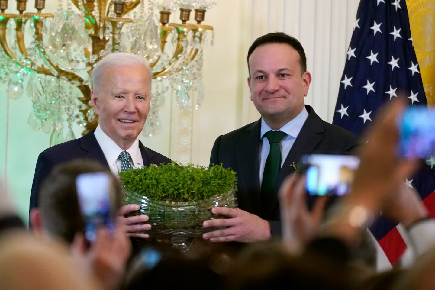 Ireland's Prime Minister Leo Varadkar, right, presents President Joe Biden with a bowl of Shamrocks during a St Patrick's Day reception in the East Room of the White House. Photo / AP