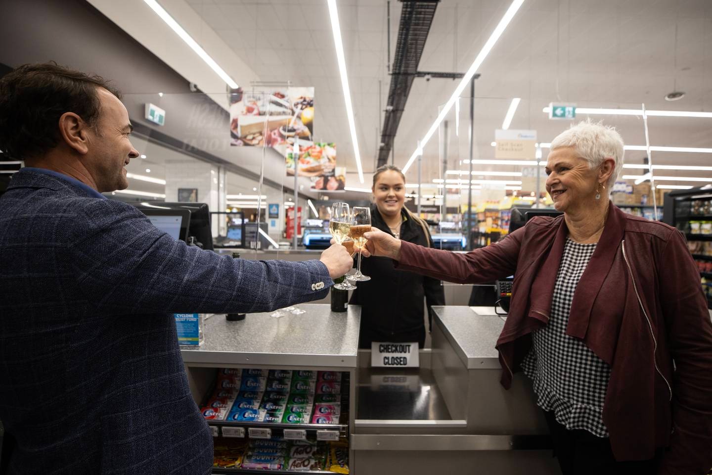 Fresh Choice owner, Craig Grant (left) celebrates his store's mega winning ticket. Photo / George Heard Fresh Choice owner, Craig Grant (left) celebrates his store's mega winning ticket. Photo / George Heard
