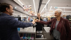 Fresh Choice owner, Craig Grant (left) celebrates his store's mega winning ticket. Photo / George Heard Fresh Choice owner, Craig Grant (left) celebrates his store's mega winning ticket. Photo / George Heard