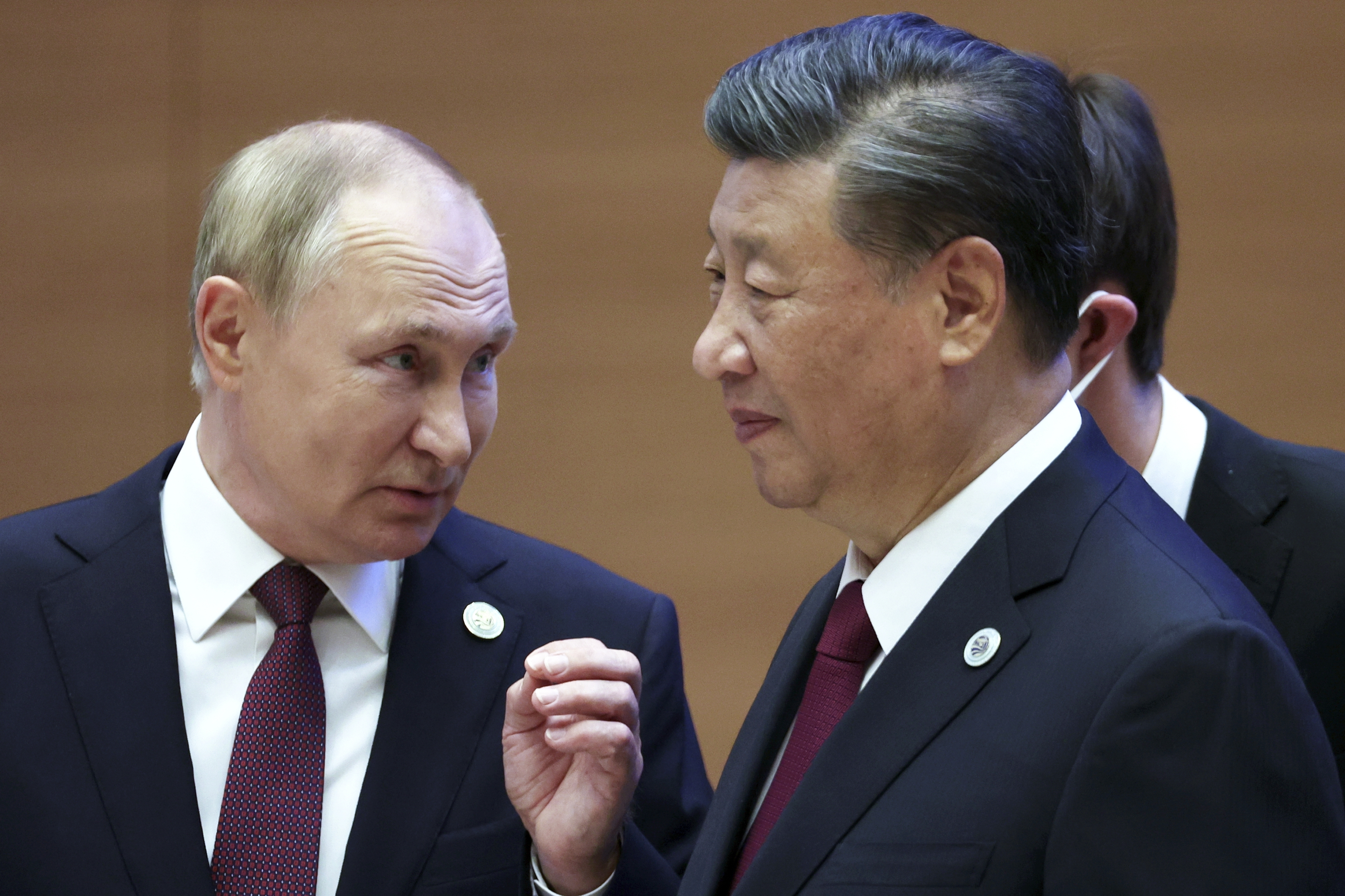 Russian President Vladimir Putin, left, gestures while speaking to Chinese President Xi Jinping. Photo / AP