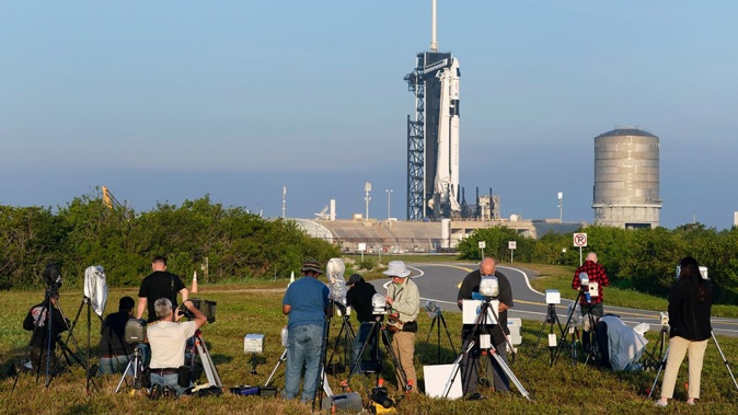 Photographers reset their remote cameras to cover the launch of the SpaceX Falcon 9 rocket with the crew capsule Endeavour at the Kennedy Space Center in Cape Canaveral, Florida, on March 1.