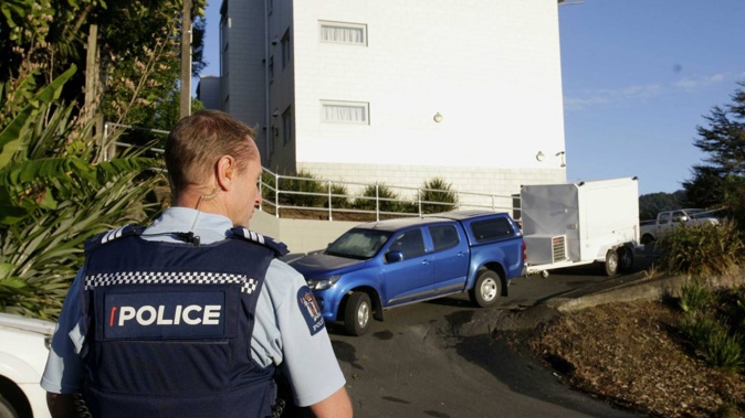 Police outside the block of flats at Anzac Rd, Morningside, where a man was allegedly fatally stabbed. Photo / Tania Whyte